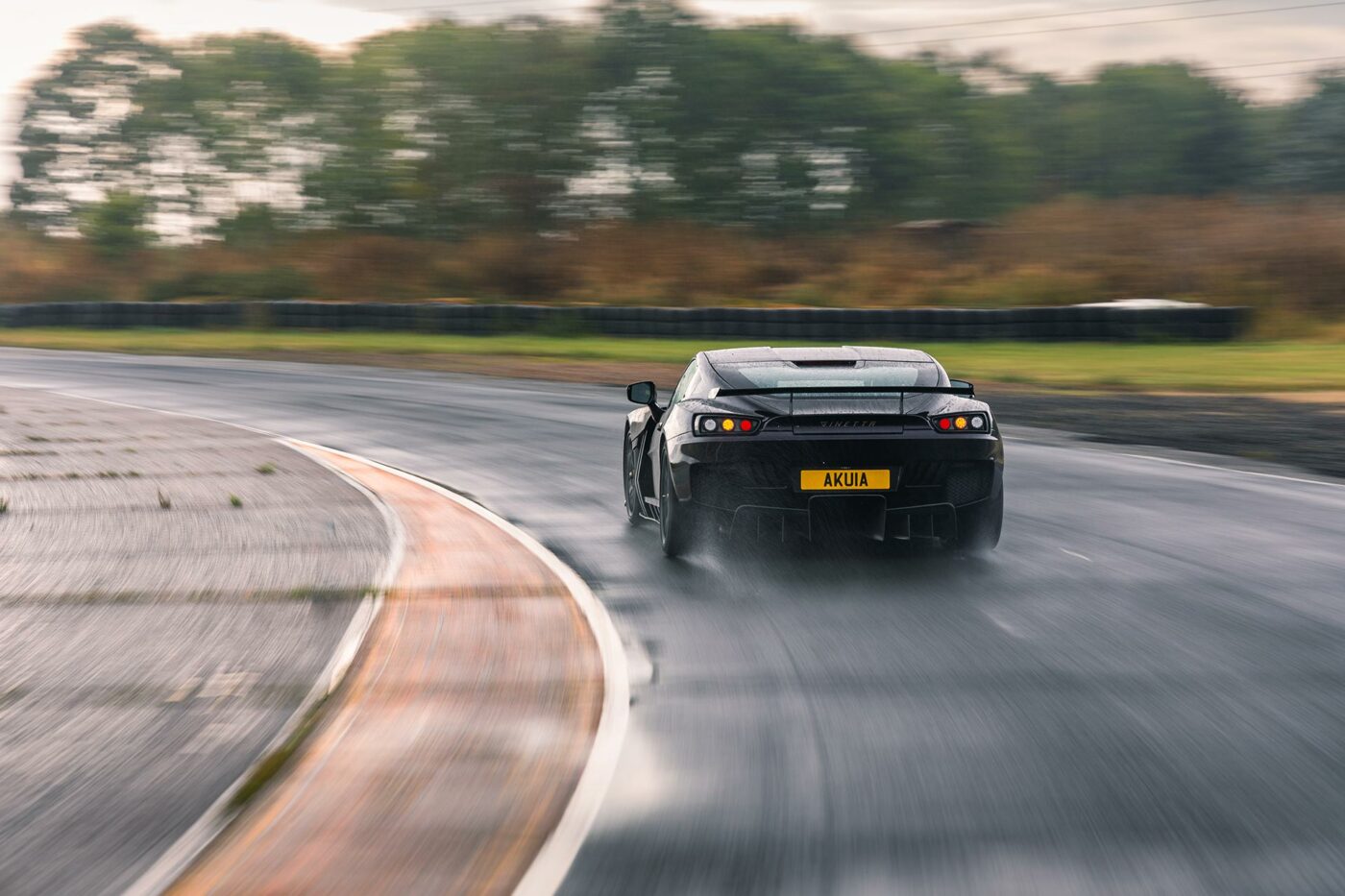 rear of Ginetta Akula supercar on a road