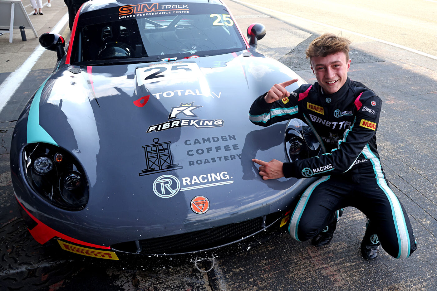 Ginetta racer posing with race car