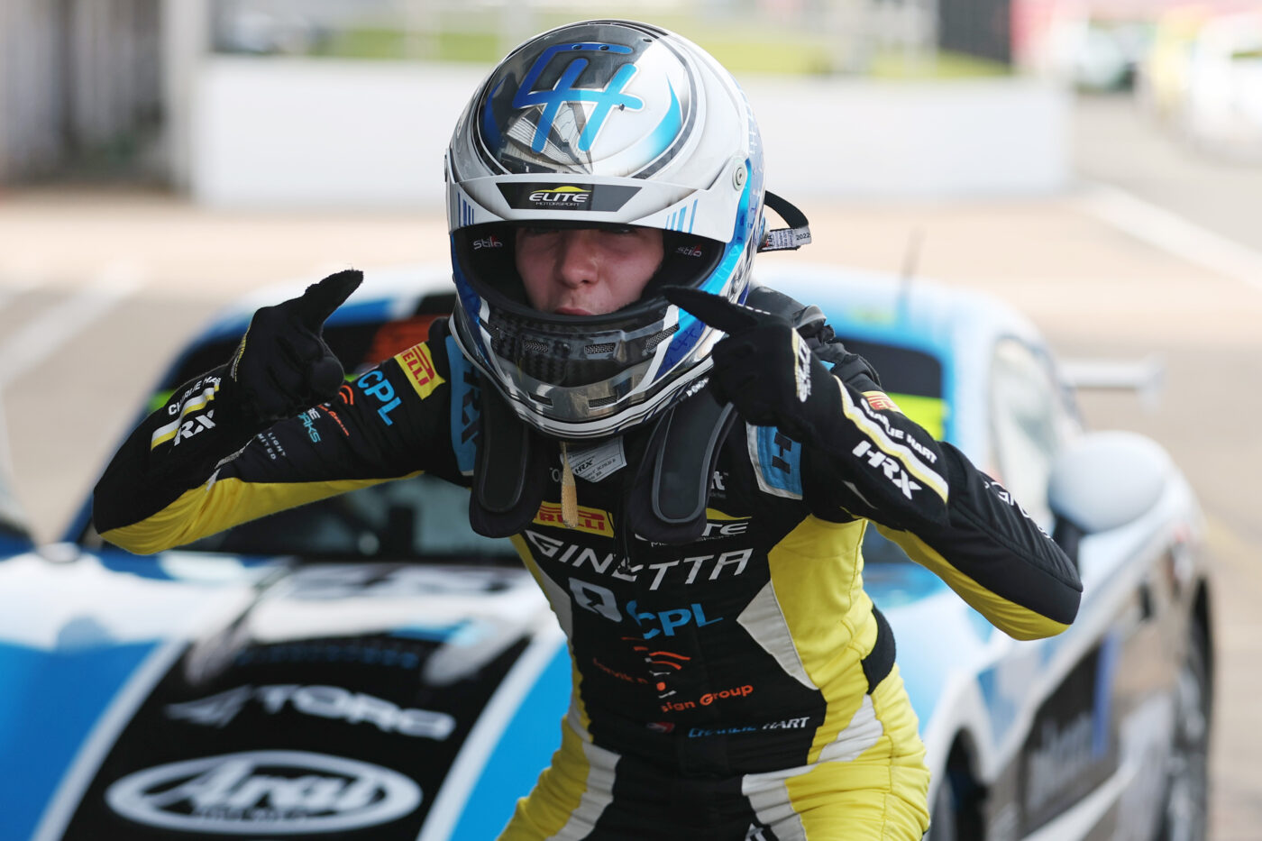 racer celebrating a win on the Silverstone National circuit